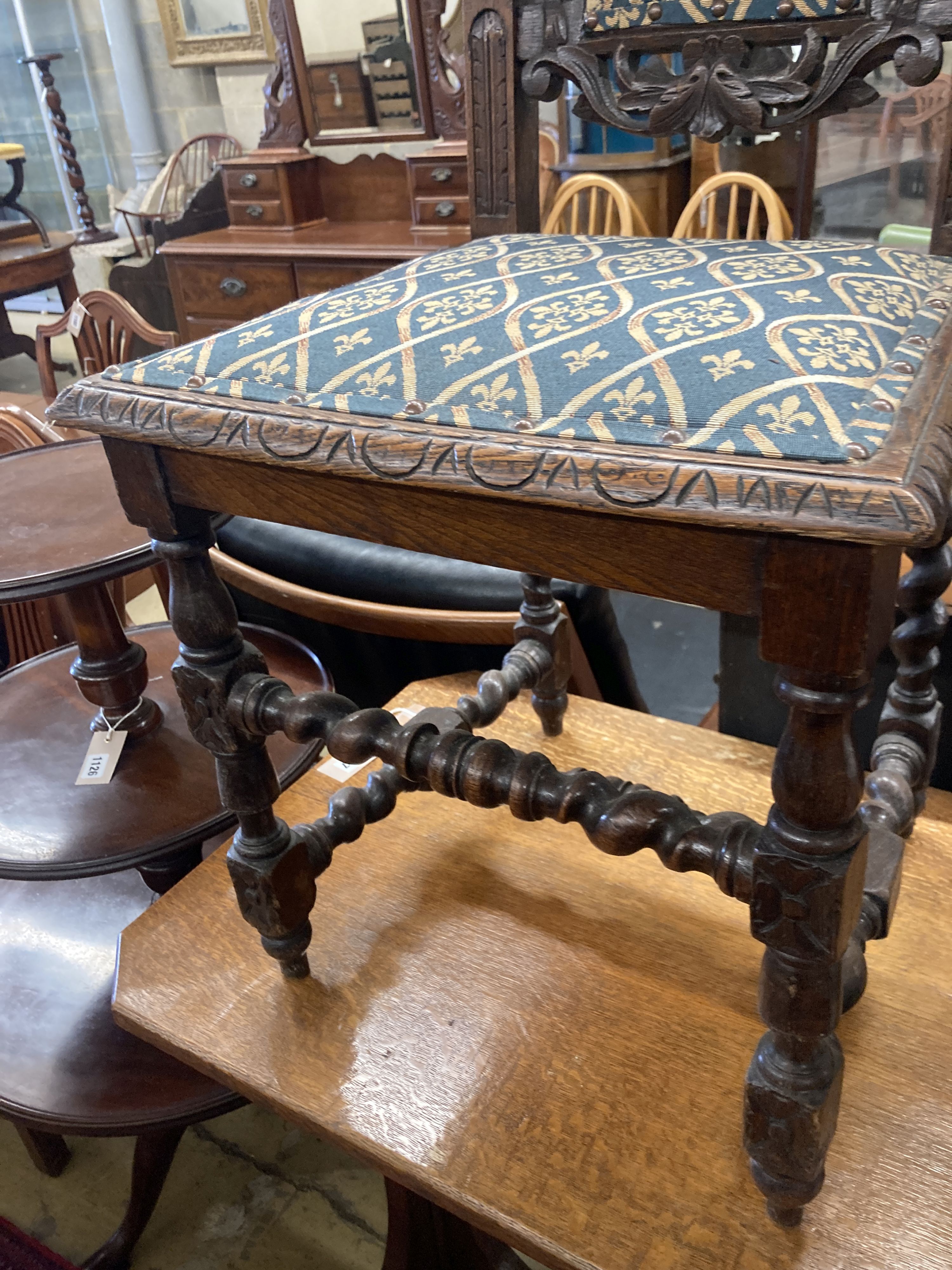 A pair of late 19th century Flemish carved oak panel backed dining chairs